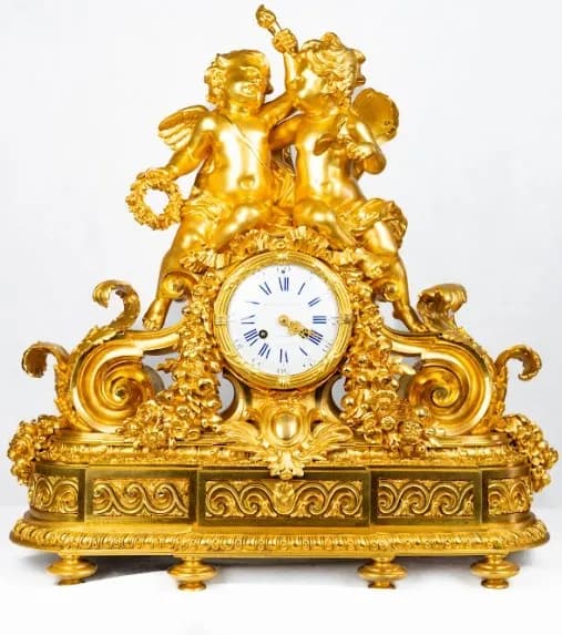 Gilded bronze mantle clock with Putti, 19th century