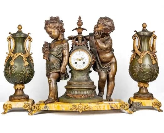Three piece bronze patinated metal clock set