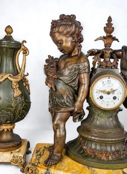 Three piece bronze patinated metal clock set