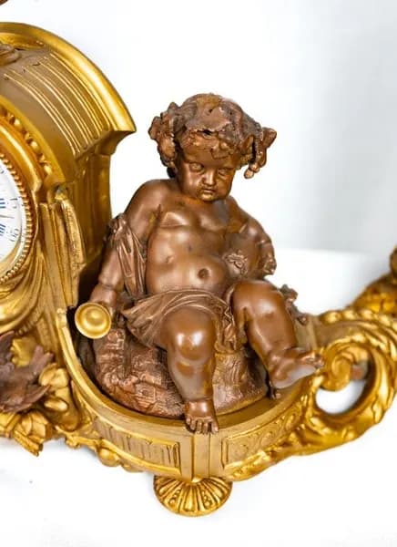 Three piece mantle clock set, gilded and patinated metal