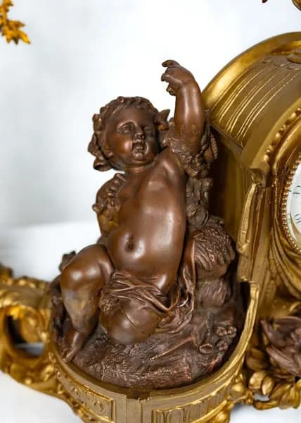 Three piece mantle clock set, gilded and patinated metal