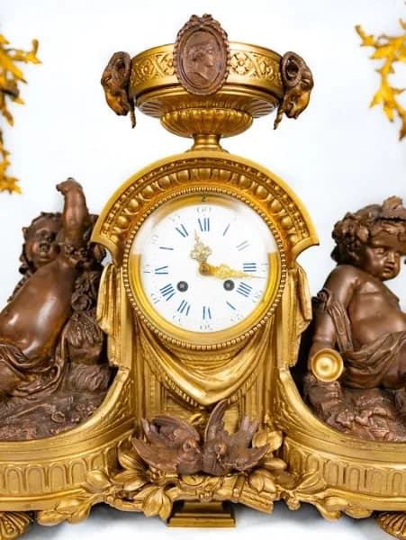 Three piece mantle clock set, gilded and patinated metal