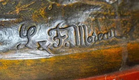 Three piece patinated metal clock set  Moreau 'Le Commerce'