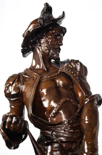 Bronze sculpture of a medieval hunter with dogs