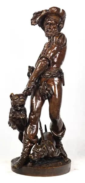 Bronze sculpture of a medieval hunter with dogs
