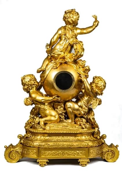 Mantel clock by Lerolle Frères, with three putti