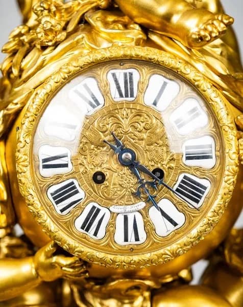 Mantel clock by Lerolle Frères, with three putti