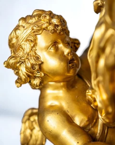 Mantel clock by Lerolle Frères, with three putti