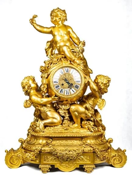 Mantel clock by Lerolle Frères, with three putti