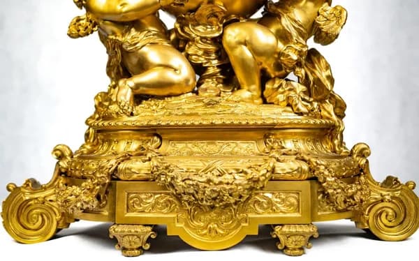 Mantel clock by Lerolle Frères, with three putti
