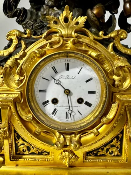 Three-piece French mantel clock with candelabra pair