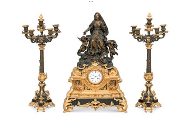Three-piece French mantel clock with candelabra pair