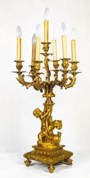 French fire-gilt candelabrum with putti
