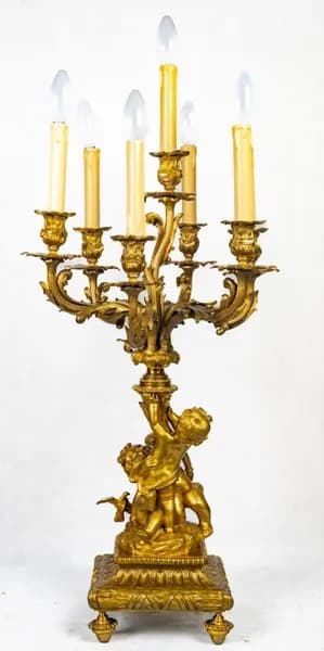 French fire-gilt candelabrum with putti