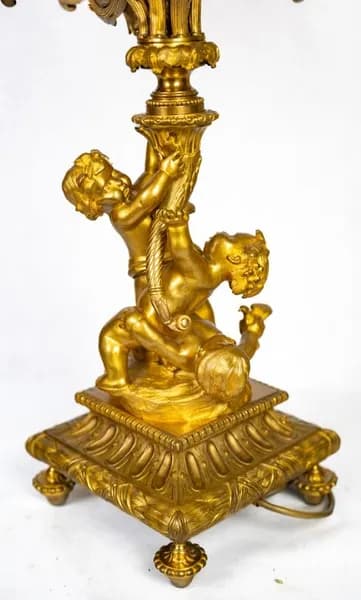 French fire-gilt candelabrum with putti