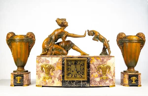 Art Deco mantel clock with a pair of vases