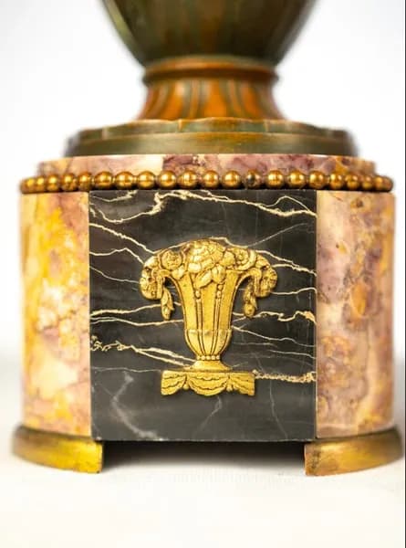 Art Deco mantel clock with a pair of vases