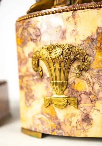 Art Deco mantel clock with a pair of vases